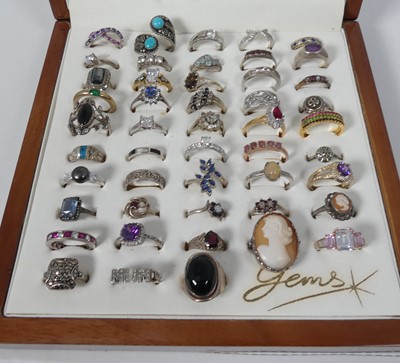 Lot 301 - A collection of forty-eight silver dress rings,...