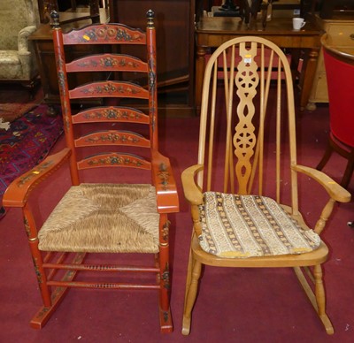 Lot 1366 - A red floral painted ladder back rush seat...