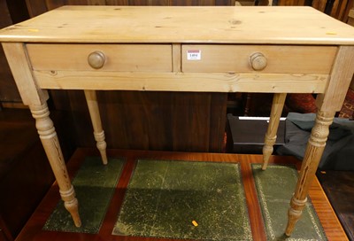 Lot 1404 - A Victorian pine two-drawer side table raised...