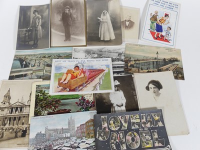 Lot 468 - A collection of Edwardian postcards to include...