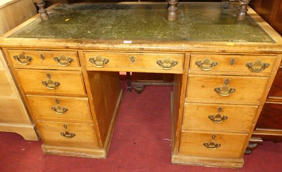 Lot 1409 - A circa 1900 pine and gilt tooled green...