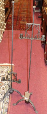 Lot 1431 - A pair of ecclesiastical iron twin branch...