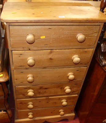 Lot 1432 - A pine narrow chest of six long drawers, width...