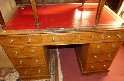 Lot 1454 - A late Victorian oak and later gilt tooled red...