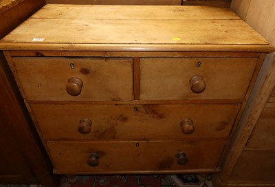 Lot 1457 - A Victorian pine low chest of two short over...