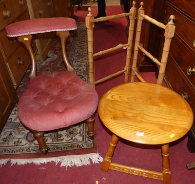 Lot 1461 - An Ercol mid-elm circular low occasional table,...