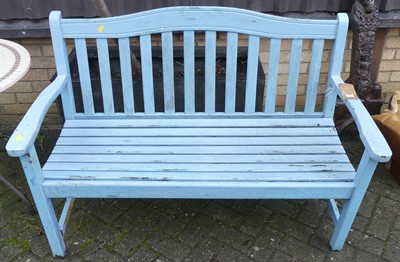 Lot 1470 - A contemporary slatted teak two seater garden...