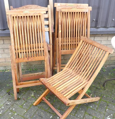 Lot 1472 - A set of four contemporary slatted teak...