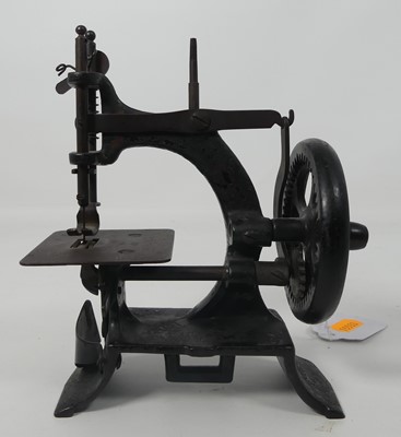 Lot 484 - A miniature working model of  a sewing machine,...