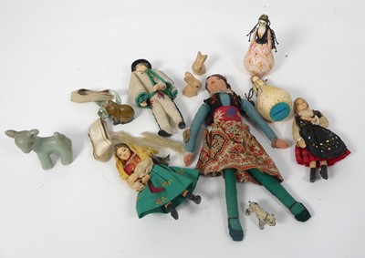 Lot 504 - A collection of miniature dolls and animal...