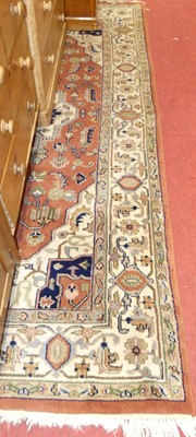 Lot 1147 - A Persian woollen rust & cream ground Tabriz...