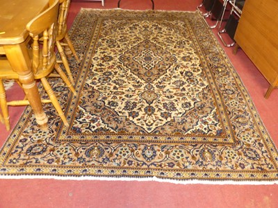 Lot 1153 - A Persian woollen cream ground Tabriz rug,...