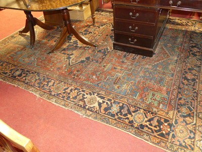 Lot 1155 - A Persian woollen red & blue ground Tabriz rug...