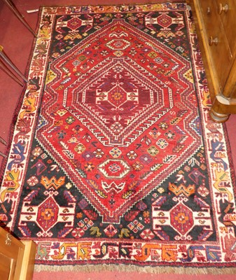 Lot 1157 - A Persian woollen red ground Bakhtiari...