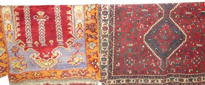 Lot 1160 - A Persian woollen red ground Shiraz rug, 200 x...