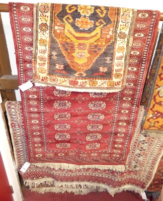 Lot 1161 - A Persian woollen cream ground Bokhara rug,...