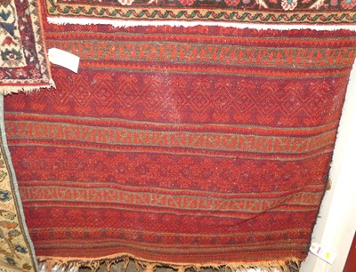 Lot 1163 - A Turkish woollen red ground kilim rug