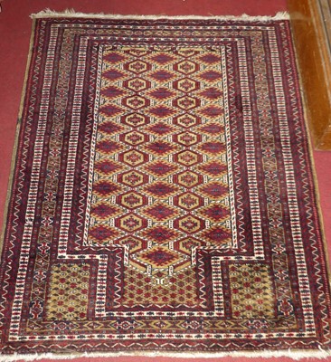 Lot 1169 - A Persian woollen red ground prayer rug, 116 x...