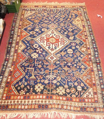 Lot 1171 - A Persian woollen red, blue and cream ground...