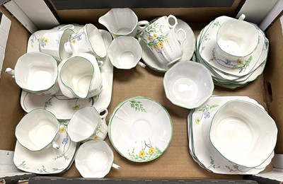 Lot 547 - A Heathcote floral decorated part tea service