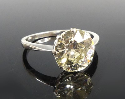 Lot A white metal diamond solitaire ring,...