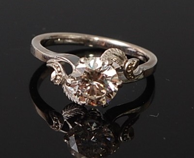 Lot A white metal diamond solitaire ring,...