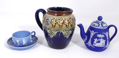 Lot 524 - A Doulton Lambeth miniature jug, impressed...