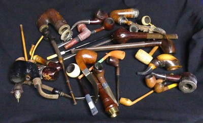 Lot 81 - Assorted pipes including a carved wooden stove...