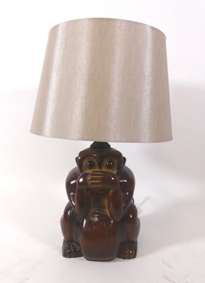 Lot 121 - A reproduction composition monkey table lamp...