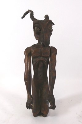 Lot 125 - An African tribal craved soft wood devil...