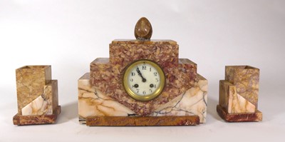 Lot 155 - An Art Deco polished and veined pink marble...