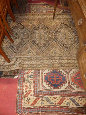 Lot 1160 - Three various Persian woollen rugs (each faded,...