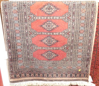 Lot 1165 - Two Persian woollen Bokhara rugs, each having...