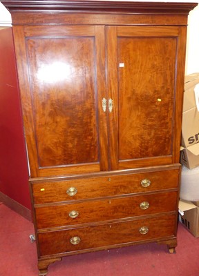 Lot 1168 - A 19th century mahogany linen press, the twin...