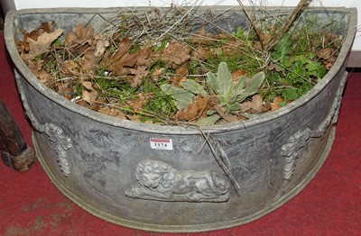 Lot 1174 - A demi-lune lead garden planter, with raised...