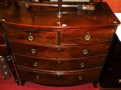 Lot 1203 - A Regency mahogany bow front chest of two...