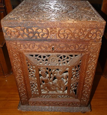 Lot 1210 - A 19th century Burmese carved teak tantalus...