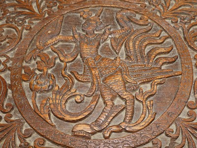 Lot 1210 - A 19th century Burmese carved teak tantalus...