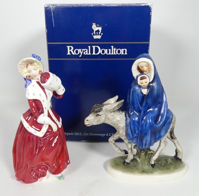 Lot 285 - A Royal Doulton porcelain figure of a lady...