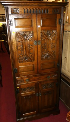 Lot 1215 - An Old Charm oak free standing drinks cabinet,...