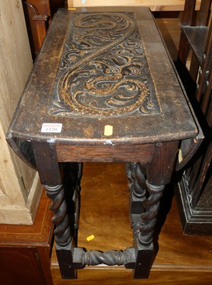 Lot 1220 - An early 20th century relief carved oak low...