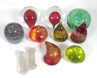 Lot 329 - A collection of coloured glass paperweights,...