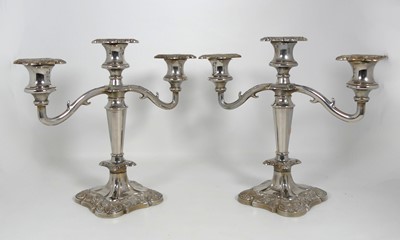 Lot 343 - A pair of silver plated three-branch table...