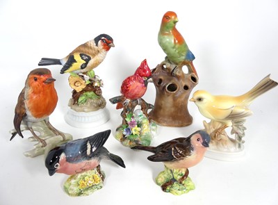 Lot 347 - A collection of bird figures, to include...