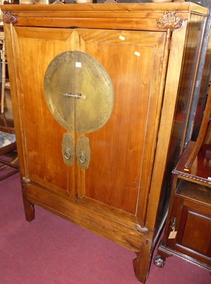 Lot 1258 - A Chinese elm and brass mounted double door...