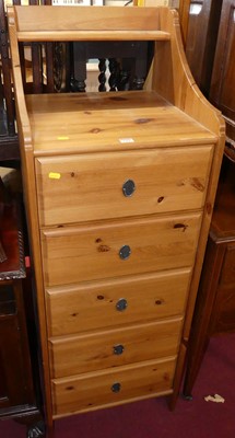 Lot 1260 - A contemporary pine narrow chest of five...