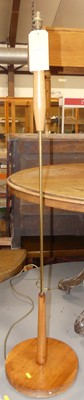 Lot 1303 - A 1970s teak and rodded metal standard lamp,...