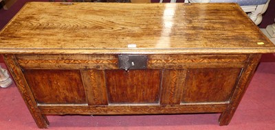 Lot 1311 - A joined oak and inlaid three panelled hinge...