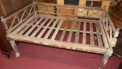 Lot 1318 - A colonial stripped hardwood opium bed, metal...