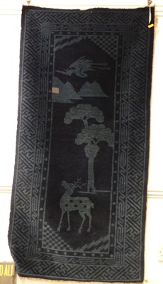 Lot 688 - A 20th century Chinese rug with blue ground...